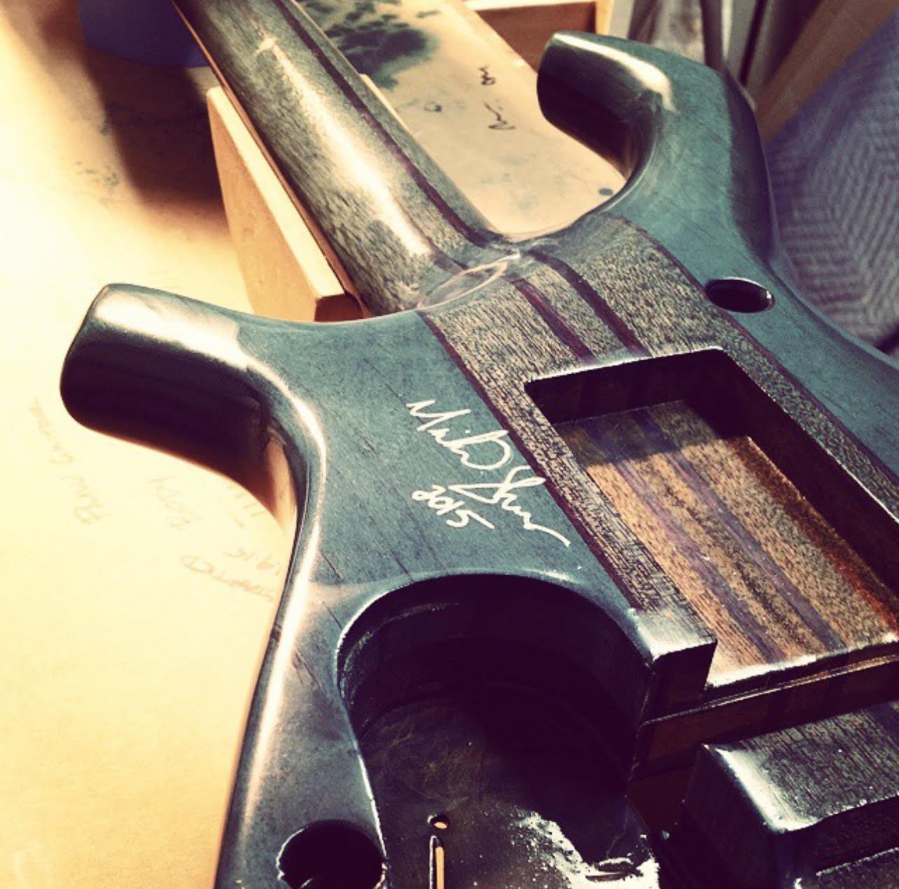 Body being shaped and finished, signature visible