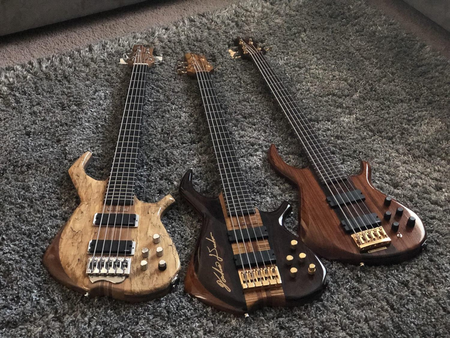 Three fretless basses, overhead